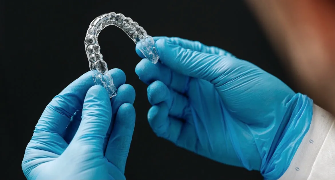 Thin, clear, shaped to your teeth.